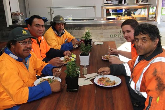 Lawrence Nathan with Bostock workmates  dining at the Bostock Organic Kitchen (Group shot at table) - Clockwise from front-left: George Ioane, Lawrence Nathan, Kevin Ioane, Ethan Smith, Casey Te Moananui