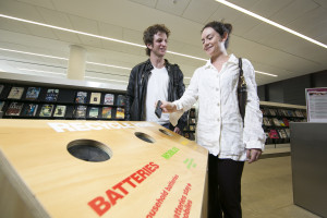 Surry Hills, Sydney - October 11, 2013: Aaron Glenane (l) and Kirra Weingarth use a new recycling station in Surry Hills Library (Photo by Jamie Williams/City of Sydney)