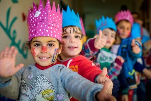 Syrian refugee children head home with crowns and painted faces after another fun day at one of the Child Friendly Space and Early Childhood Education centers for Syrian Refugee children, near Zahle' in Bekaa, Lebanon.