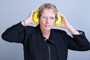 Louise Carrol, CEO, The National Foundation for the Deaf, wearing hearing protectors