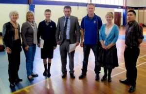 Christchurch Boys Highschool student Duncan Mazza wins an ipad for his essay on Random Acts of Kindness Day - from left.Sue Swift,Shannon Mazza,Duncan Mazza,Nick Hill principal,Kevin and & Feebee Newlands,Mark Smith Manager of Noel Leeming