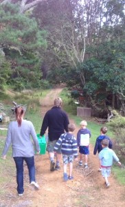 Photo of Jon Williams (project co-manager), Lee and Garrod children walking to return Pita