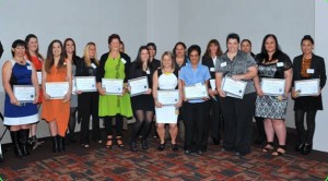 Graduates of the InfraTrain NZ Wahine Toa programme holding their NZQF Level 4 National Diploma in Business (First Line Management) certificates. Credit: State Services Commission 