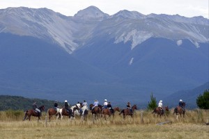 Credit: Barry Whitnall. Riders pause to enjoy the views of Travers Range, Nelson Lakes